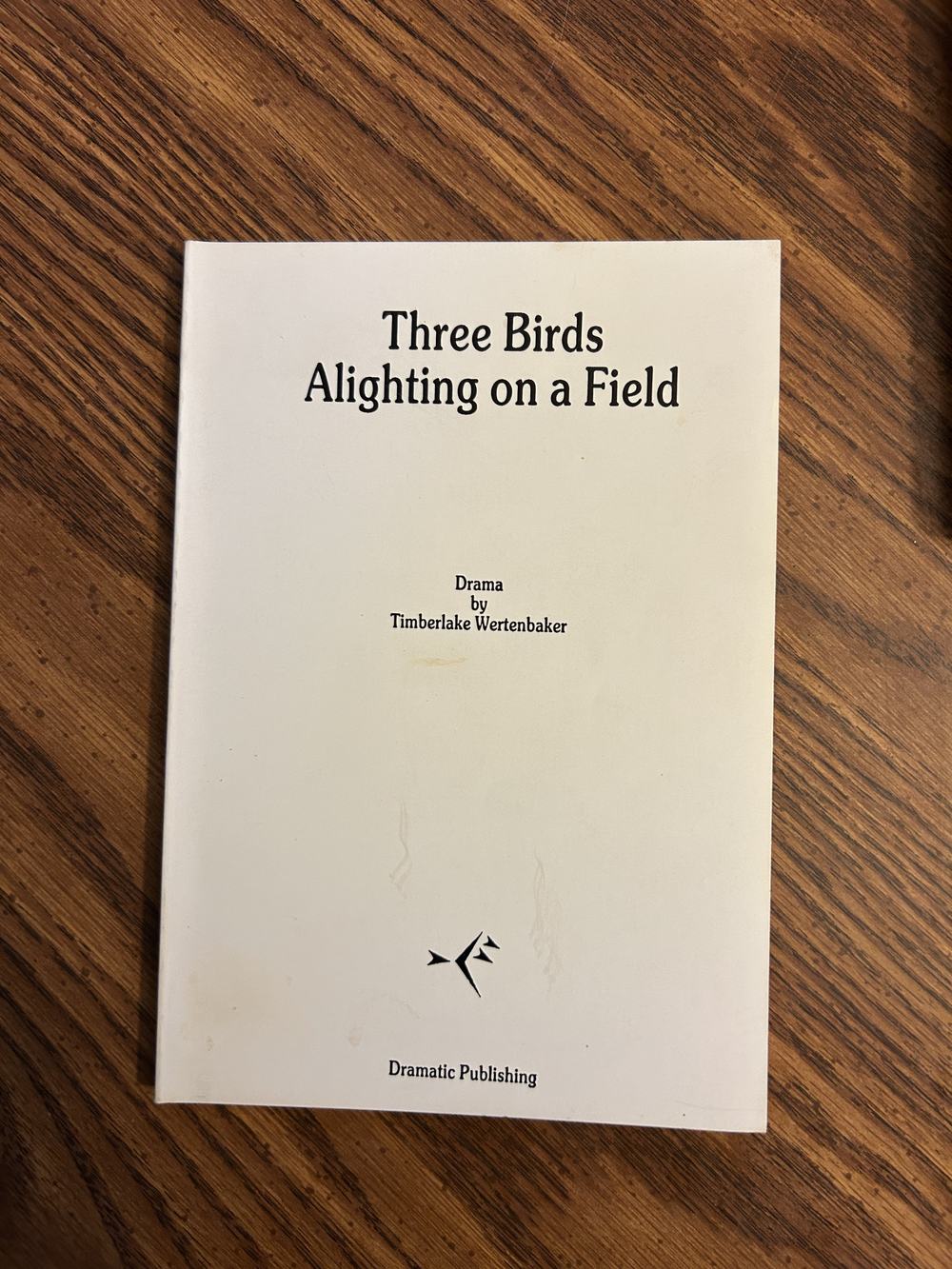 Three birds alighting on a field, photo 1 of 5